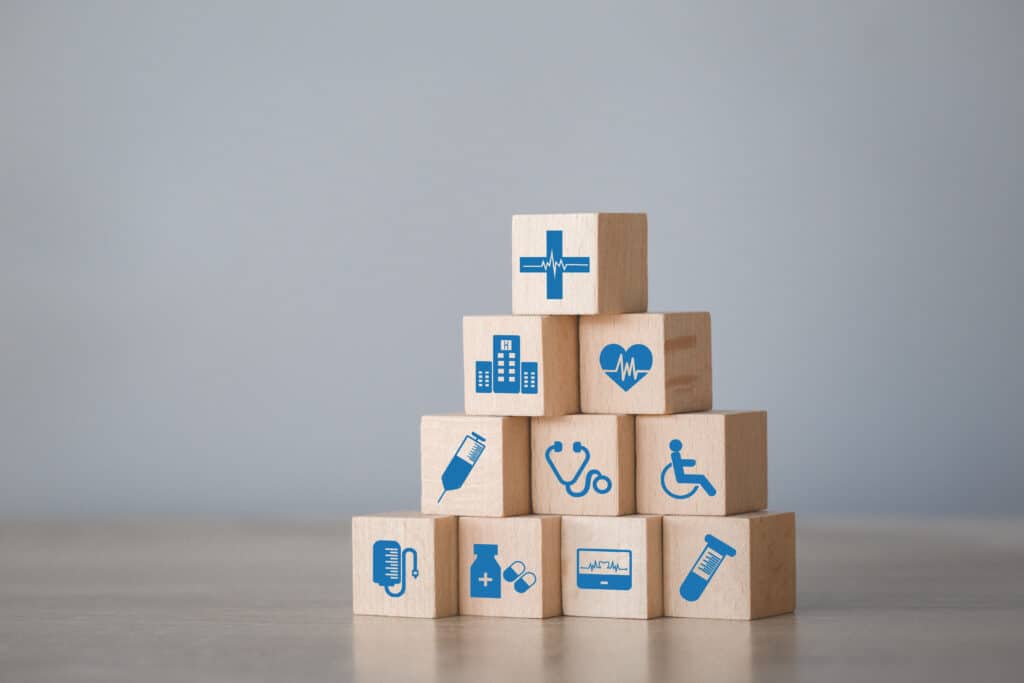 Wooden blocks with health care icons