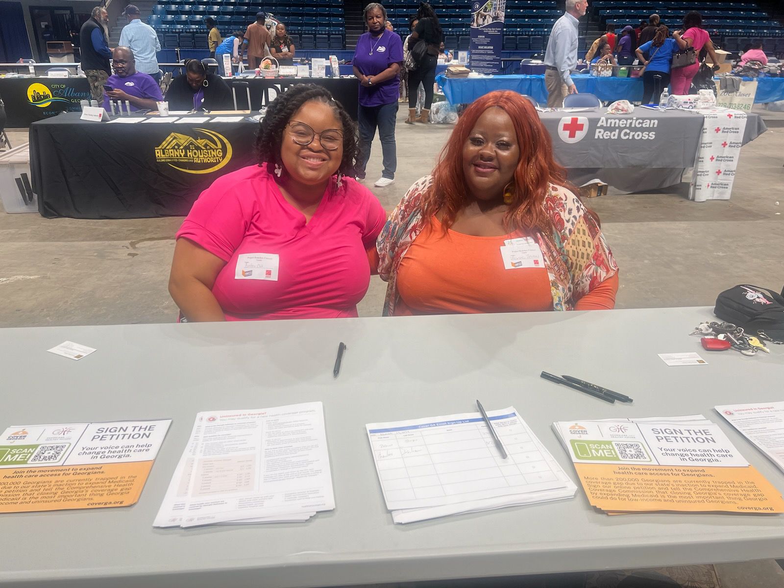 Coverage Captains Bristeria Clark and Joanna Jackson collaborating at a Back to School event in Dougherty County, GA